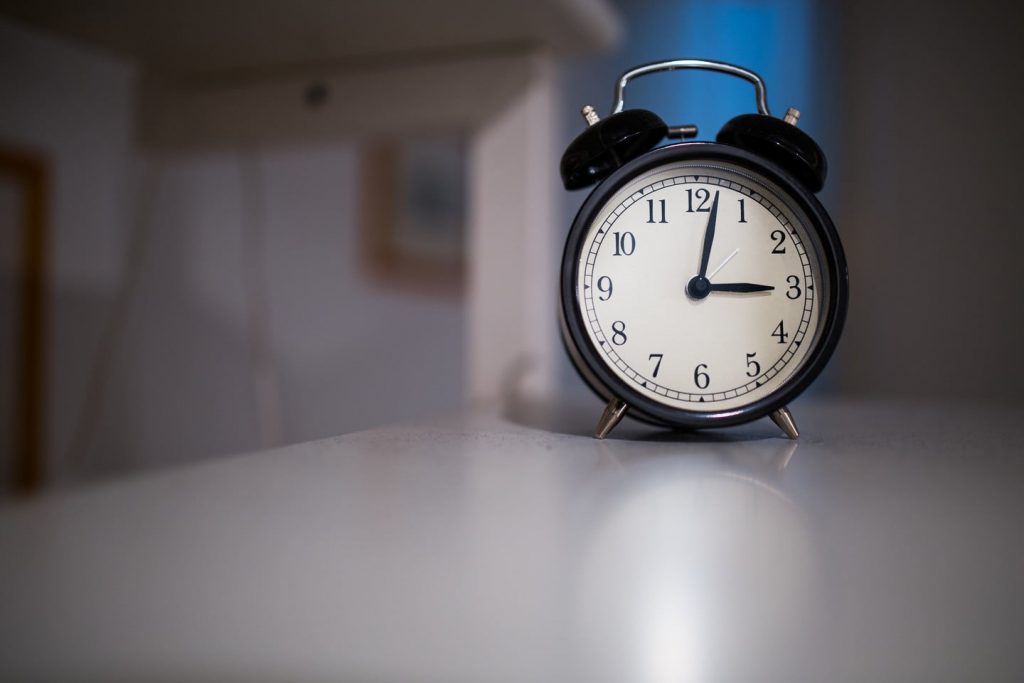Put the alarm clock away from your reach so that you have to get up for it each morning.
